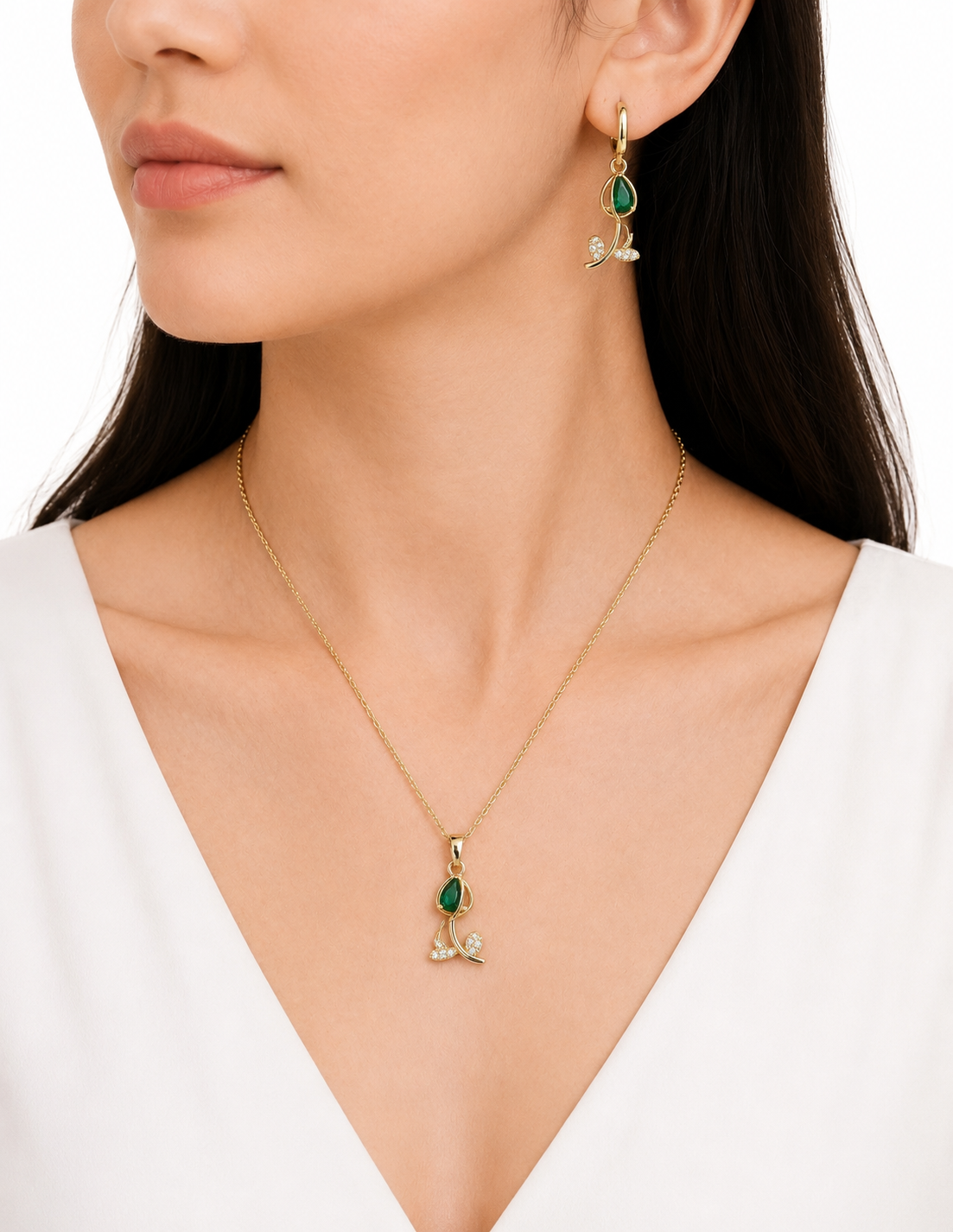 Change the background to a pure white countertop so that only the necklace and earrings are visible, in a professional photoshoot style.