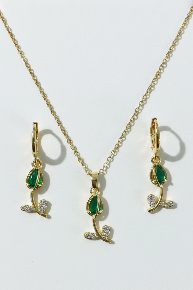 Change the background to a pure white countertop so that only the necklace and earrings are visible, in a professional photoshoot style.